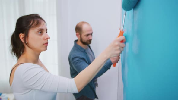 Woman Painting Wall