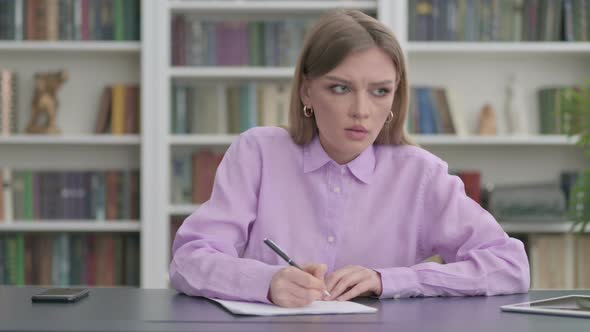 Pensive Woman Trying to Write a Letter