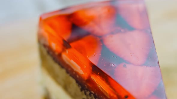 A Slice of Cake with Strawberries and Jelly