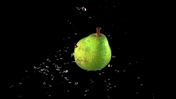 Super Slow Motion is One Green Pear Under Water with Air Bubbles