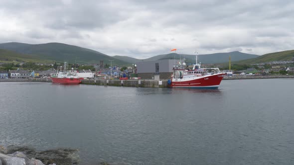 Boats Docked At Dingle Marina In Kerry, Ireland. - wide shot