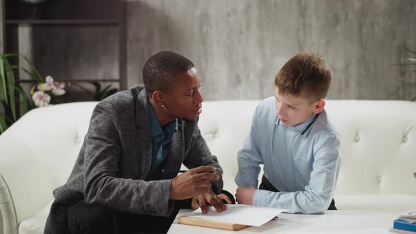 Black Man Conducts Private English Lesson to Little Boy