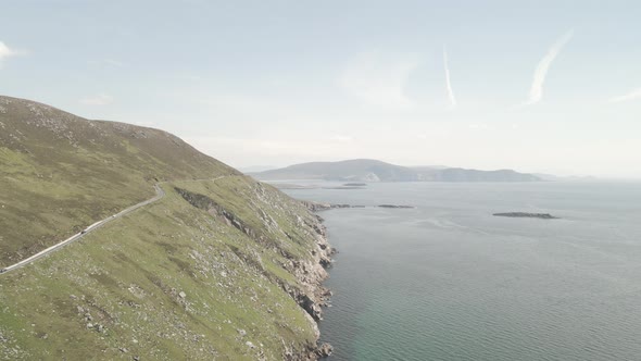 Cars Driving Through Narrow Road On Cliff In Achill Island And The Atlantic Ocean In Ireland. - aeri