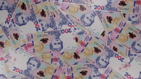 200 Ukrainian hryvnia bills background. Many banknotes.
