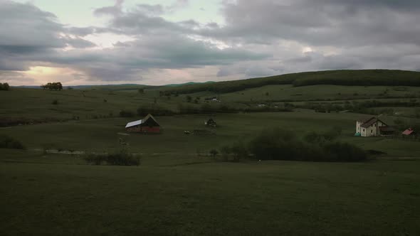 Cinematic aerial view of sunset over Tocile, Sibiu