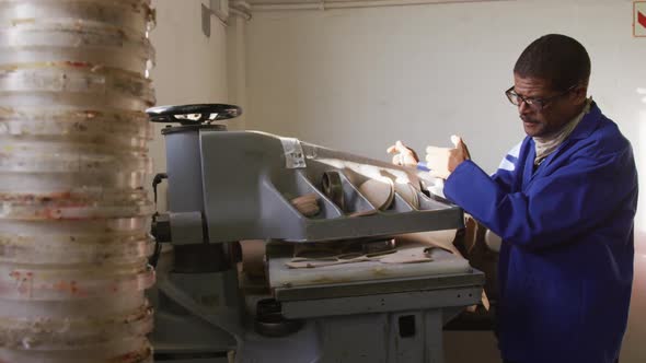 Mixed race man working in factory