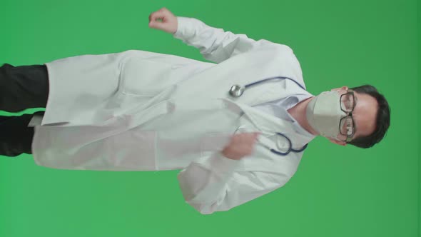 Asian Doctor With Stethoscope Wearing Mask, Running On Green Screen Chroma Key