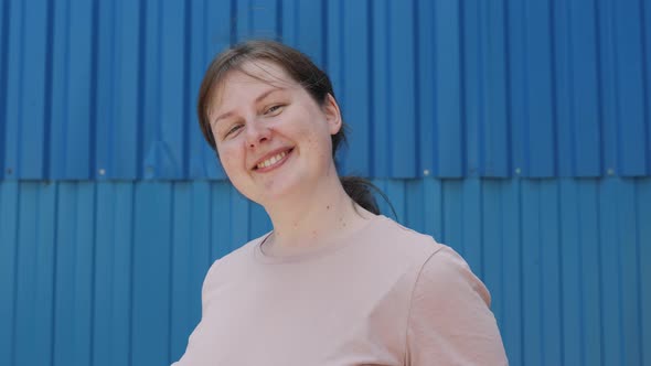 Portrait of Simple Paleskinned Woman with Freckles and Moles