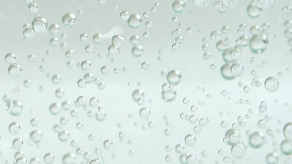 Air bubbles of the fizzy water.