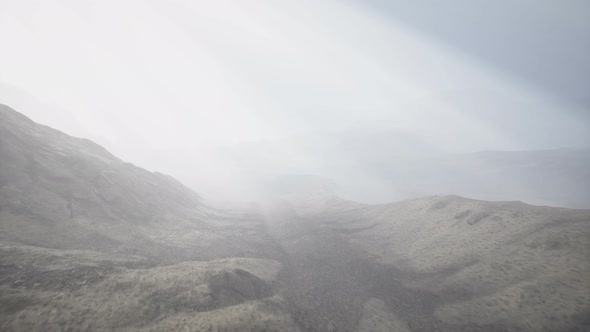 Sun Rays Against the Backdrop of the Mountains alt