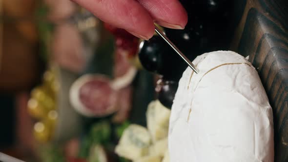 Chef Cuts Camembert Italian Cheese Spanish Brie in Traditional Restaurant Tasty Holiday Table Wine