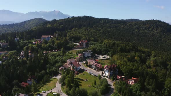 Aerial: Predeal mountain resort town in Romania Bucegi mountains, Prahova Valley