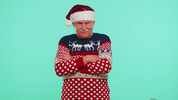 Elderly Senior Lovely Grandfather Man Wears Red New Year Sweater and Hat Smiling Looking at Camera