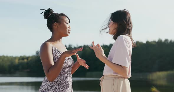 Beautiful Friends Meet on a Summer Afternoon at the Lake They Talk Tell Each Other Stories Ask