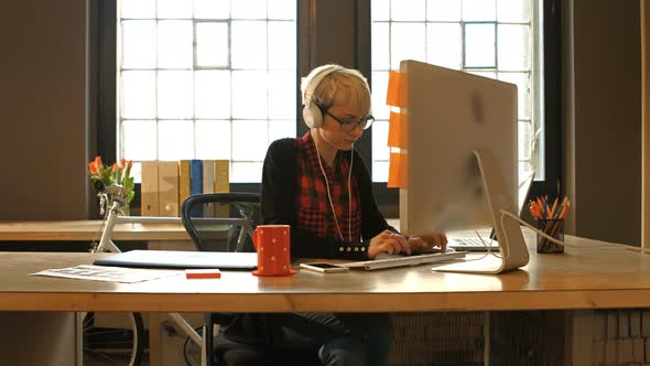 Female graphic designer working on computer