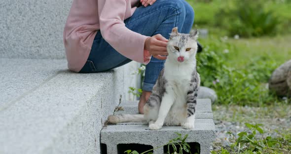 Woman cuddling cat