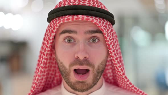 Close Up of Face of Shocked Young Arab Man