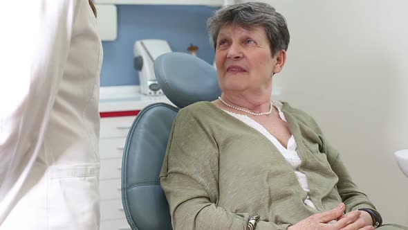 Elderly female patient at dentist ordination having checkup