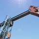 Low Angle Shot of Oil Pump Jack Pumping Crude Oil Under Clear Blue Sunny Sky - VideoHive Item for Sale