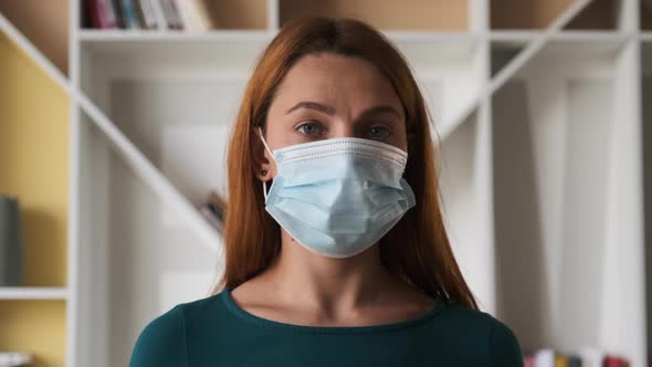 Portrait of a Young Woman with Mask at Home .Concept of Health and Safety Life