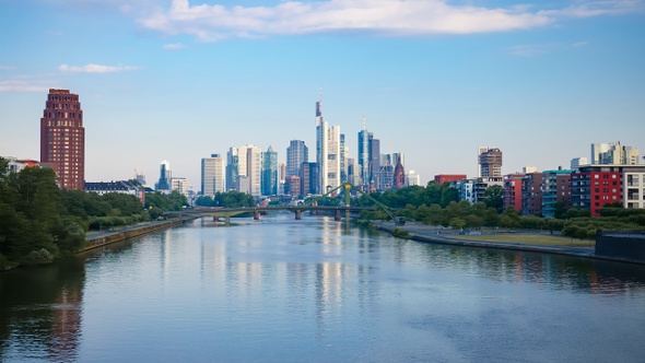 Frankfurt skyline hyperlapse time lapse, blue sky with clouds, office buildings and skyscraper