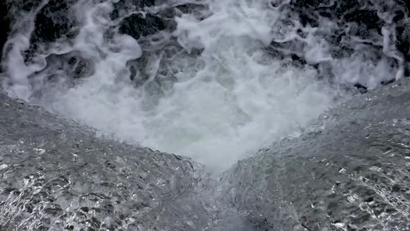 waterfall , falling water captured from the top.