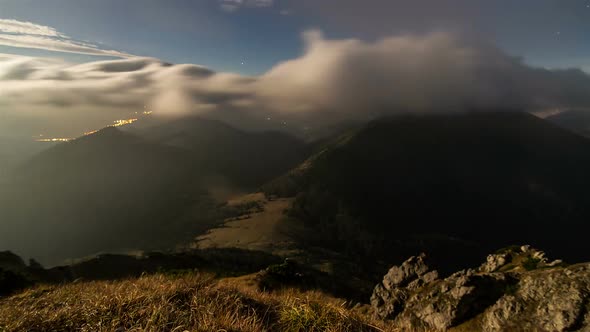 Fast Moving Clouds in Moonligth Night Sky in Mountains