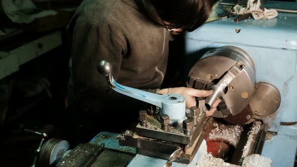 Turner Works on a Lathe, Grinds the Metal Part and Checks the Dimensions of the Caliper