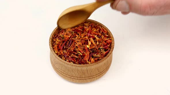 Chef Taking Spices Paprika or Chili Flakes From Wooden Spice Jar