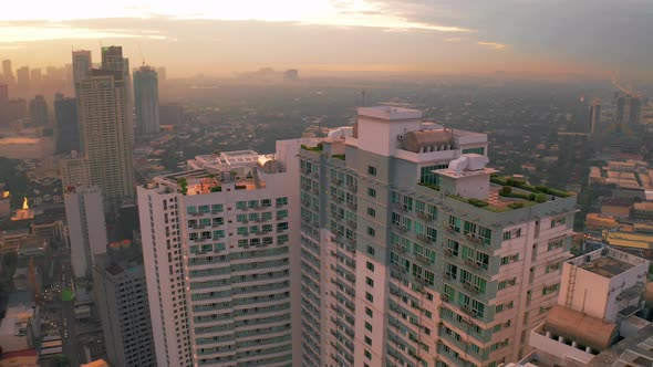 Modern Building Sunrise Skyline Background in Manila City, Philippines. Aerial 