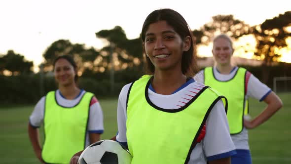 Female soccer player standing on soccer field. 4k