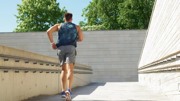 Young Man Running Upstairs