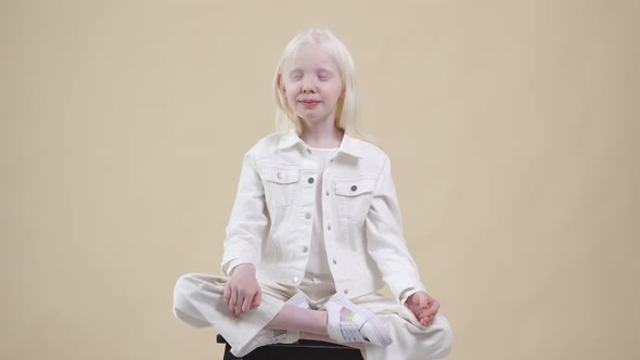 Adorable Albino Child Model Meditate in Lotus Pose