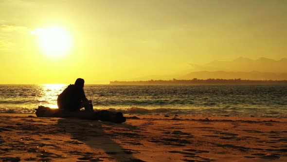 One girl suntans on tropical bay beach voyage by turquoise lagoon with bright sand background of the