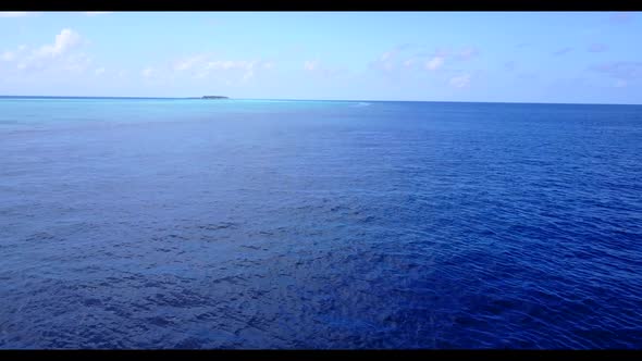 Aerial landscape of tranquil coast beach time by aqua blue lagoon and white sandy background of a da