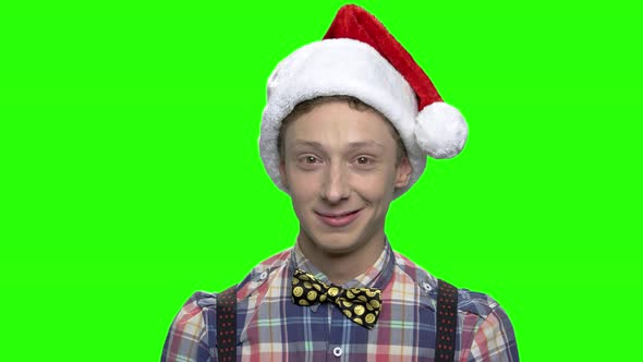 Portrait of Young Teenager Boy with Christmas Hat