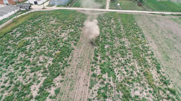 Preparatory Field Work with a Tractor. Aerial View.