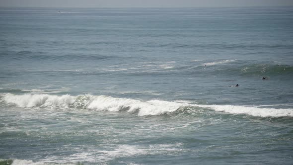 Ocean waves and surfers