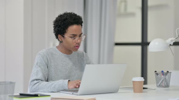 Young African Woman Having Loss While Using Laptop 