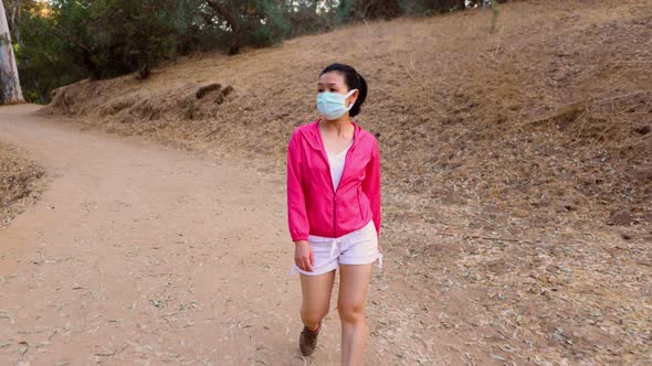 Asian woman going for a hike