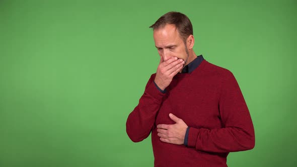 A Middleaged Handsome Caucasian Man Has Stomachache  Green Screen Background