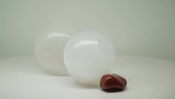 Two Crystal Balls With Different Sizes, Purple And Red Gem Stones Interconnected To Each Other - Clo
