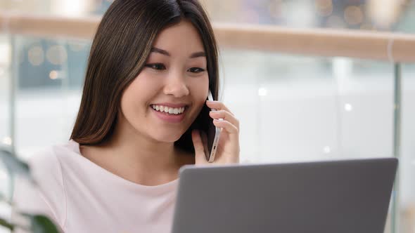 Headshot Asian Businesswoman Professional Adviser Freelancer Woman Talking on Phone with Customer