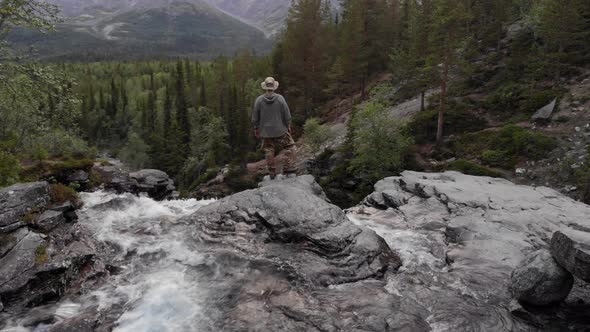 A Traveler Admires a Beautiful View of the Natural Landscape