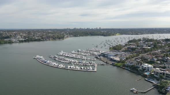 Luxury ocean village marina at San Souci and Taren Point, Sydney Australia. Cloudy and blue skies ov