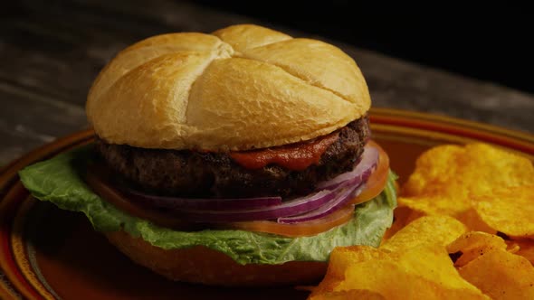 Rotating shot of delicious burger and potato chips - BBQ 167