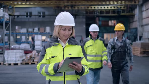 Worker Male Warehouse Worker Engineer Man in a Helmet Working on the Construction Site of the