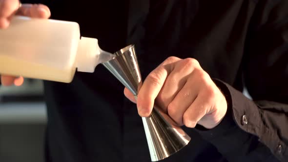 the bartender prepares a cocktail. close-up.