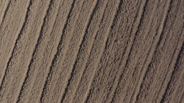 Cultivated earth with tractor plough 4K aerial video