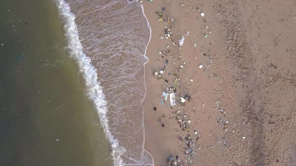 Tropical Beach In Rayong, Thailand With Waste Materials Littering On The Sand. aerial drone, top-dow